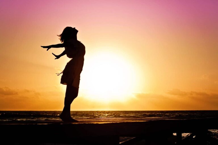 woman happiness sunrise silhouette 40192 768x512