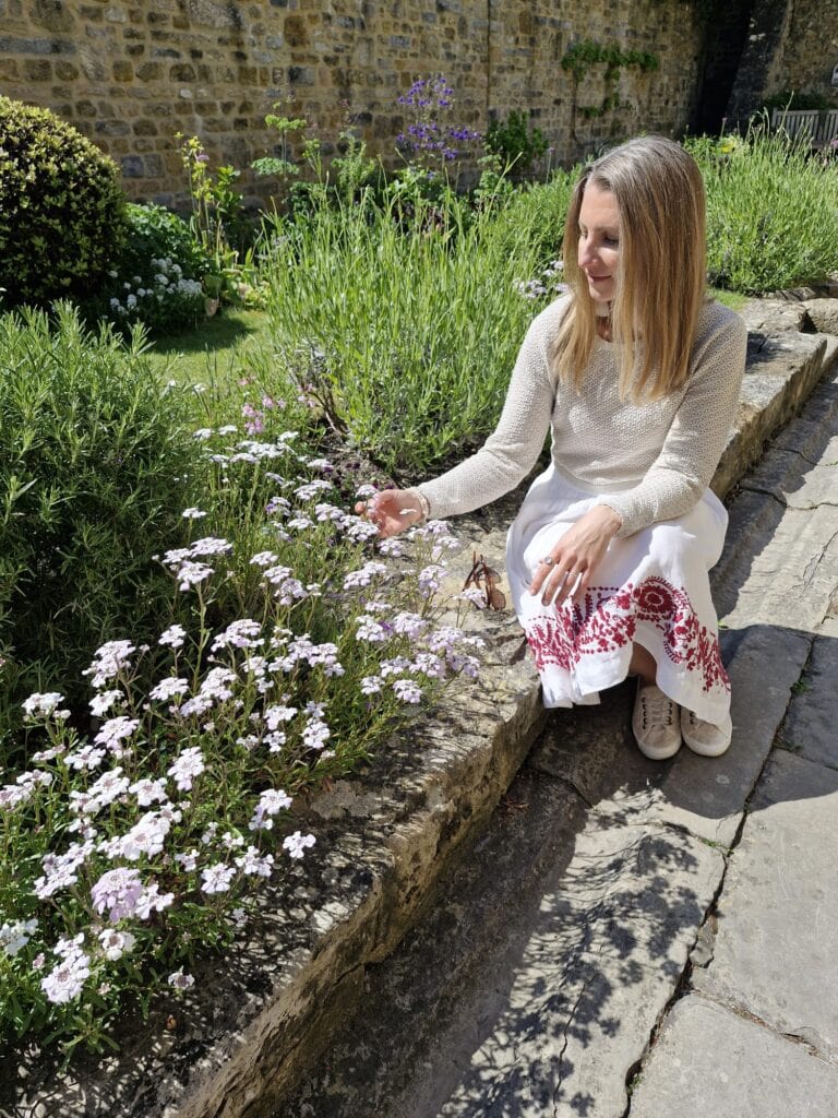 Claire with flowers 768x1024